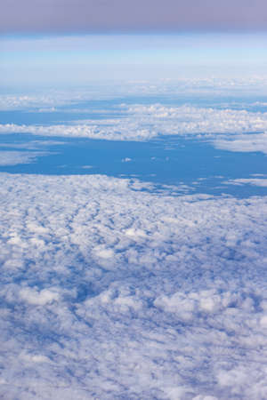 landscape above white clouds in the sky