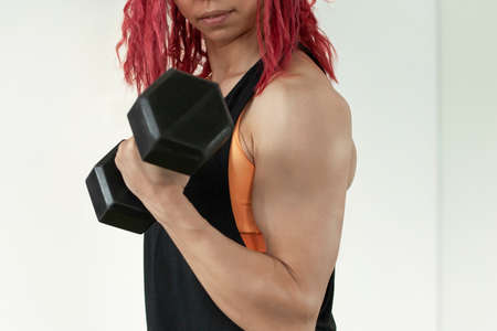 young beautiful fitness girl with muscular bodyの写真素材