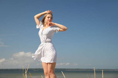 Beautiful sexy young woman enjoying summer outdoorsの写真素材