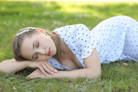 portrait of young cute girl in a summer dressの写真素材