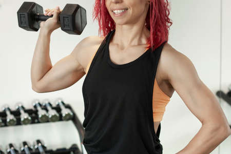young beautiful fitness girl with muscular body