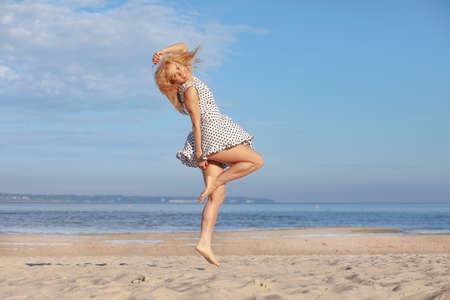 Beautiful sexy young woman enjoying summer outdoorsの写真素材