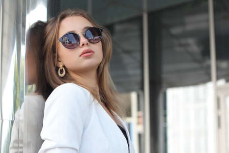 Young beautiful fashionable girl with a cute face