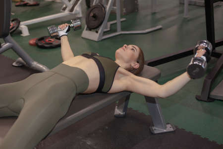 young fitness woman exercising in the gym