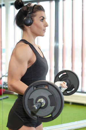 young beautiful fitness girl with muscular body