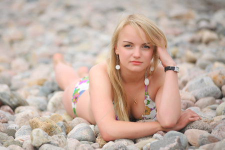young woman in the summer on the beachの写真素材