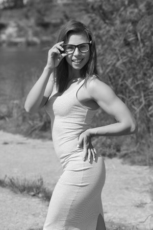 young athletic girl with red hair in a dressの写真素材