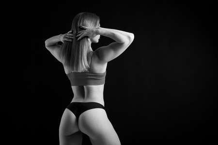 young fitness woman with beautiful athletic bodyの写真素材