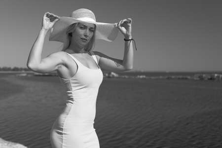 Happy woman on the beach at seaの写真素材