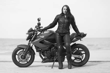 young girl on a motorcycle in the summer