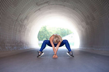 Beautiful young woman doing yoga exercise, Outdoorの写真素材