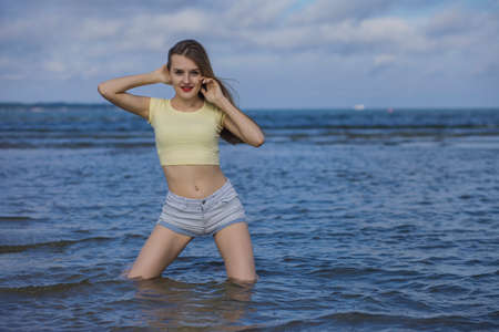 young beautiful woman in summer on the beachの写真素材