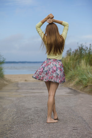 young beautiful woman in summer on the beachの写真素材