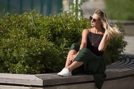 young sexy slender woman posing in clothesの写真素材