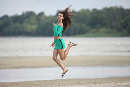 Beautiful sexy young woman enjoying summer outdoorsの写真素材