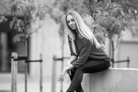 photo of a young fashionable woman in the city