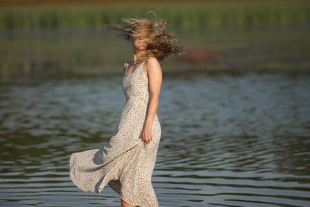 woman in the water in a dressの写真素材