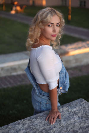 Beautiful young woman posing at the street.