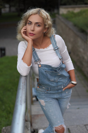Beautiful young woman posing at the street.の写真素材