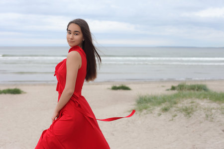 young asian teen in red long fashion dress