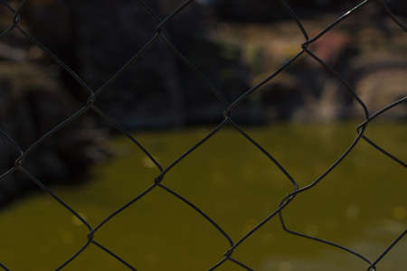 Steel fence Sun blur backgrond Abstractionの写真素材