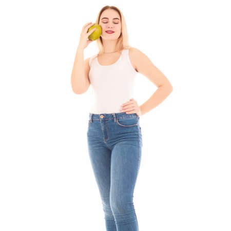 Pretty young woman with an apple, isolatedの写真素材