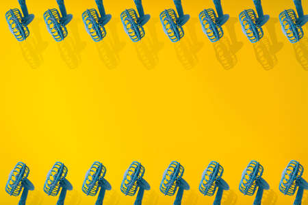 Colorful background with fan in yellow and blue colors. Minimalistic summer concept.の写真素材