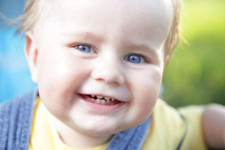 portrait of happy looking little boy close upの写真素材