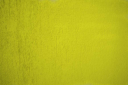 Colorful concrete yellow wall as backgraundの写真素材