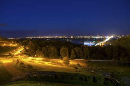 Night city view with the river, road, buildings and lights. Kyiv, Ukraineの写真素材