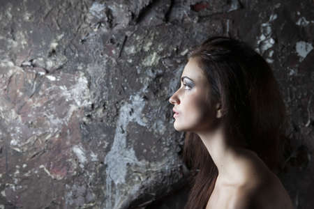 beautiful sexy woman against vintage backgroundの写真素材