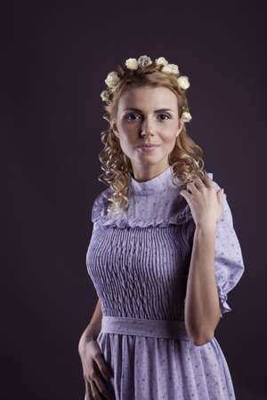 Retro woman portrait in the blue dress and flowersの写真素材
