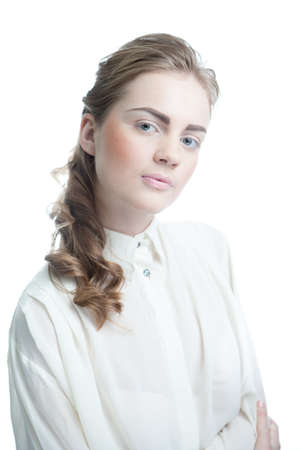 Portrait of a happy young business woman standing with white backgroundの写真素材