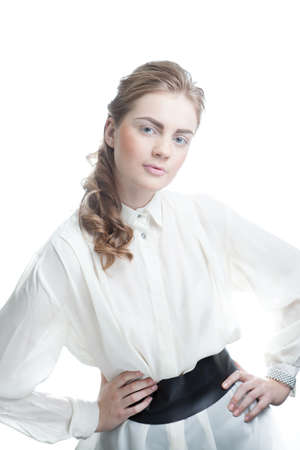 Portrait of a happy young business woman standing with white backgroundの写真素材