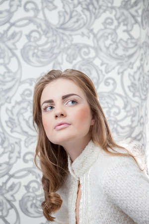 Portrait of a happy young business woman standing with white backgroundの写真素材
