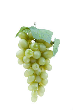 Fake plastic grapes banch on white backgroundの写真素材