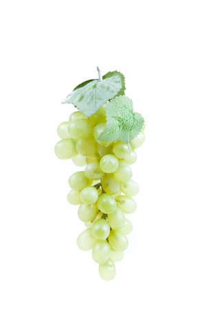 Fake plastic grapes banch on white backgroundの写真素材