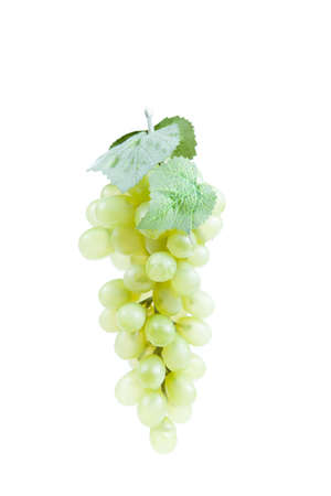 Fake plastic grapes banch on white backgroundの写真素材