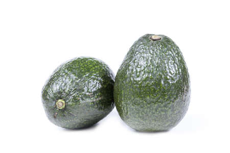 the green avocados isolated on white backgroundの写真素材