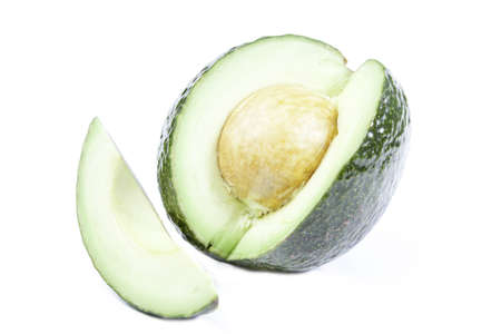 the green avocados isolated on white backgroundの写真素材