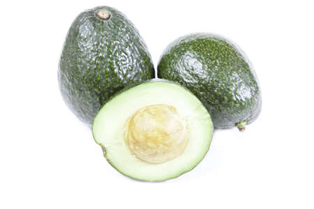 the green avocados isolated on white backgroundの写真素材