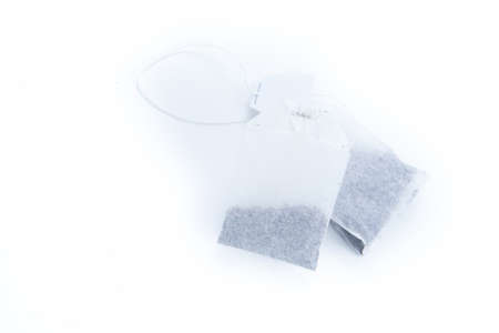 two teabags isolated on white backgroundの写真素材