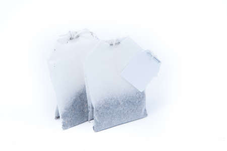 two teabags isolated on white backgroundの写真素材