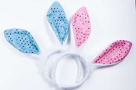 pink and blue Bunny Ears in white backgroundの写真素材