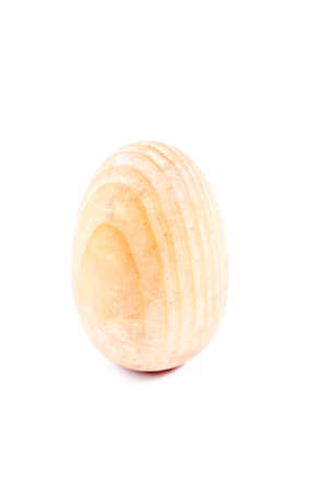 wooden easter egg isolated on white backgroundの写真素材