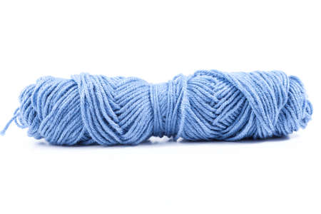 blue bobbin thread isolated on white backgroundの写真素材