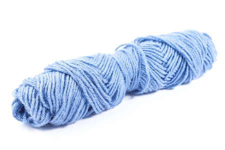 blue bobbin thread isolated on white backgroundの写真素材