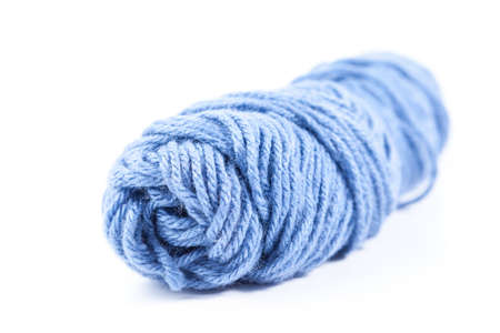 blue bobbin thread isolated on white backgroundの写真素材