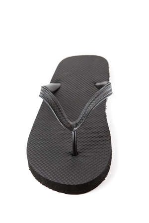 Black flip-flops isolated against a white backgroundの写真素材