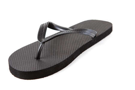 Black flip-flops isolated against a white backgroundの写真素材